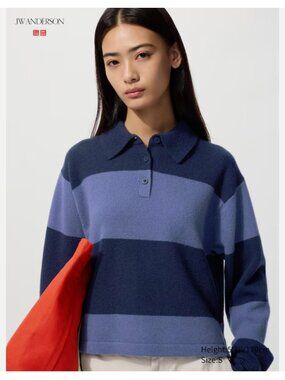 The UNIQLO X JW ANDERSON Lambswool Polo Jumper in Blue is a stylish and versatil